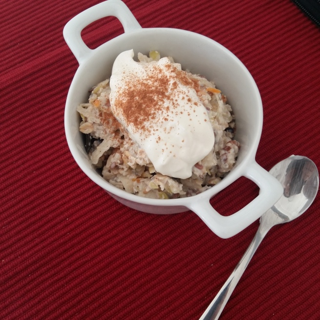 Favourite overnight oats mix with added clementine peel, grated green apple, served topped with yoghurt and cinnamon